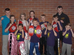 Triumphant K.9 Team with coaches Aaron Monson & Ben Mitchell